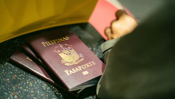 A passport with documents on a desk, the reciprocity check a foreign founder passes
